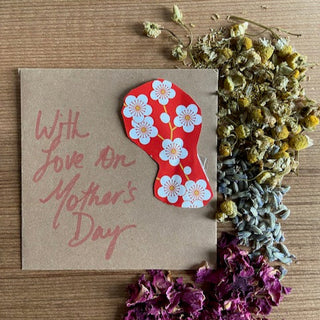 Herbs and teas and a handwritten note for mom on Mother's Day