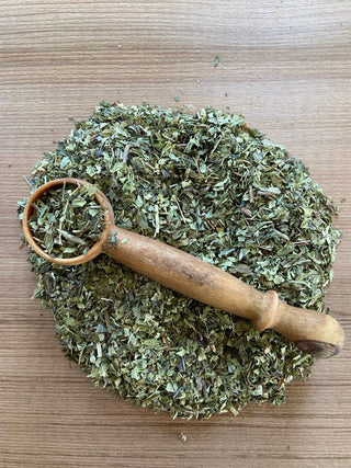 Organic mint tea, vervain tea and thyme tea with a wooden spoon by Tea of Light vibrational energy teas. 